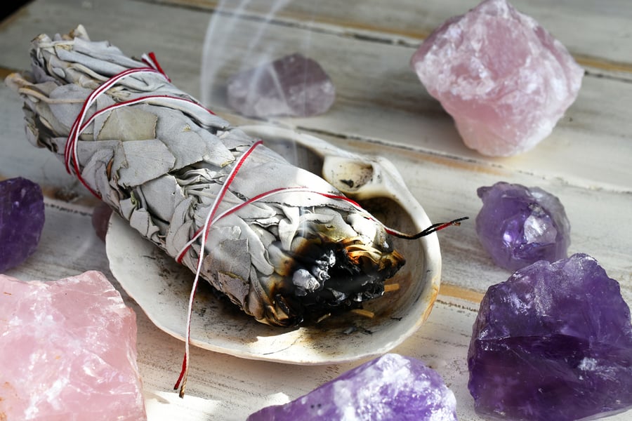 A Close Up Image Of A Burning White Sage Smudge Stick Used For Energy Clearing And Healing