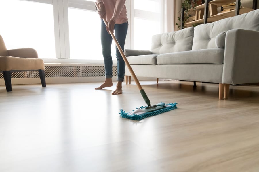 Barefoot Young Lady Cleaning The Floor