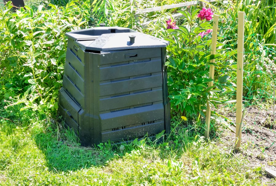 Black Plastic Compost Bin In Allotment Garden