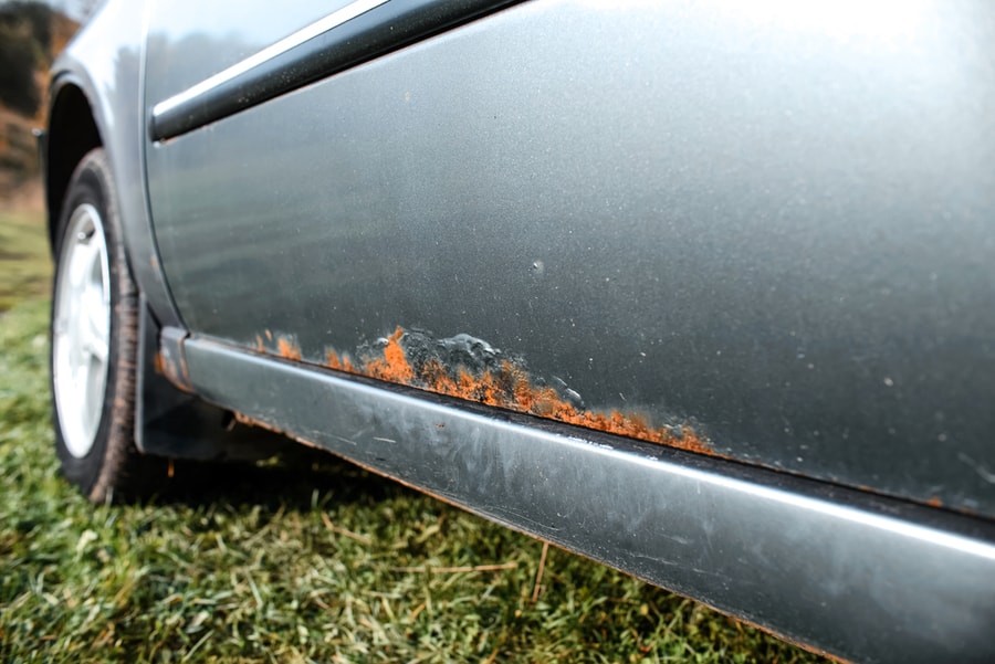 Close Up Corrosion Of Metal On A Car Body.