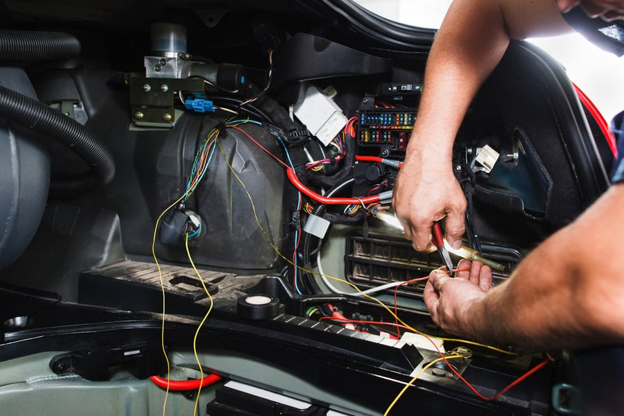 Close-Up Of Automobile Inside Under Raised Hood