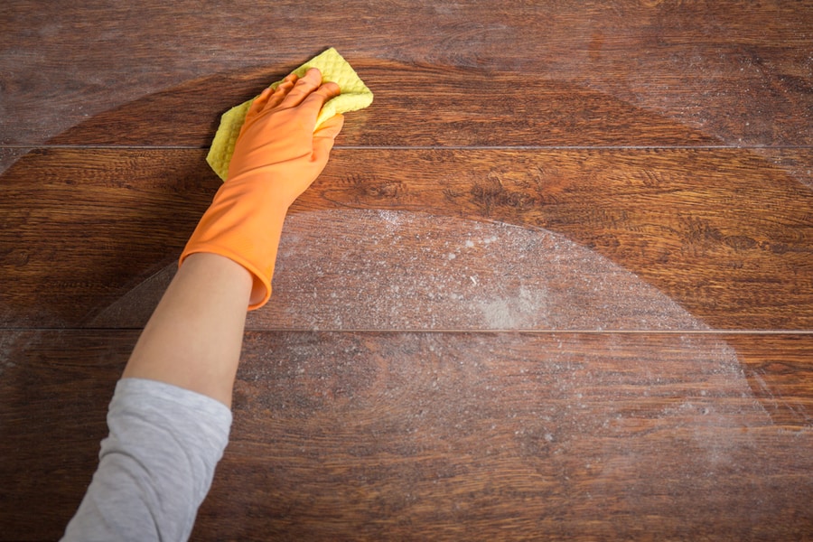 Closeup Hand Cleaning Wooden Table