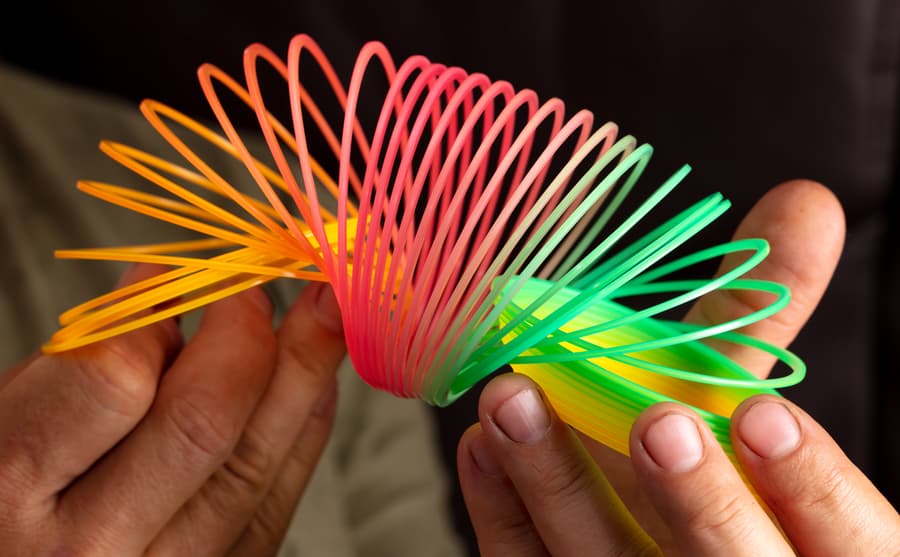 Closeup Multicolored Slinky Spring Hand