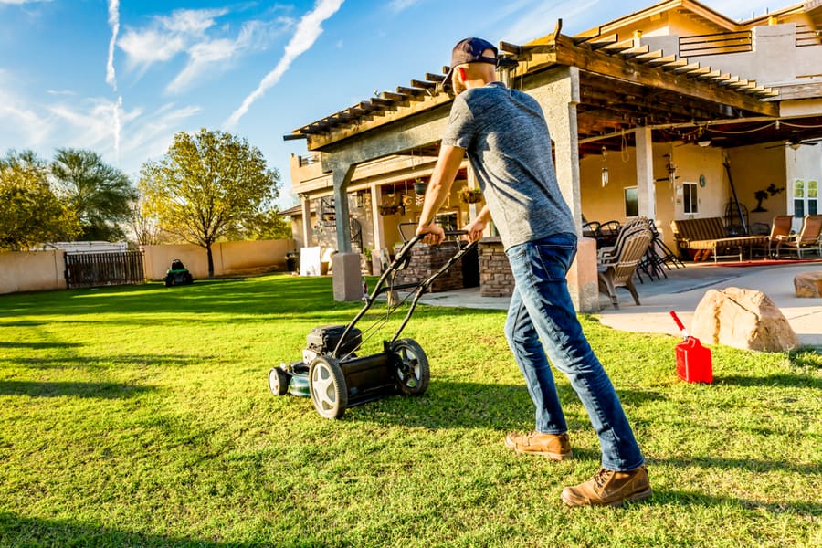 Man Mowing His Lawn