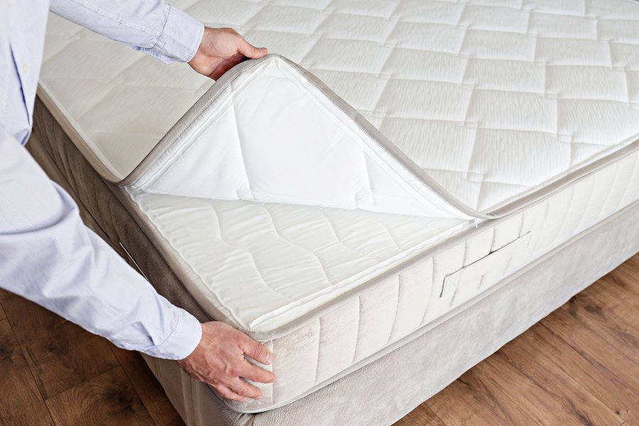 Man Showcasing Hypoallergenic Mattresses