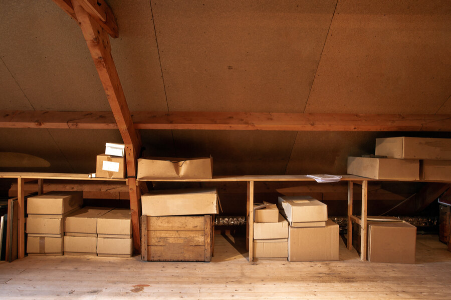 Old Wooden Attic Interior With Old Cardboard Boxes For Storage