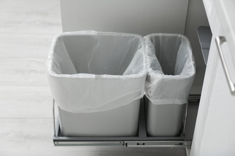 Open Cabinet With Empty Trash Bins For Separate Waste Collection In Kitchen