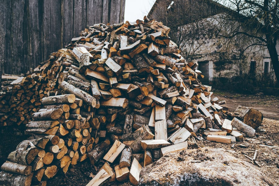 Stacking Firewood, Pile Of Firewood Loggs Outside The House