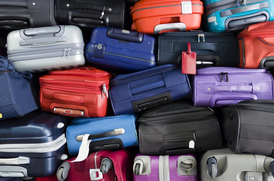 Suitcases Multicolor Stacked For Transport One Above The Other