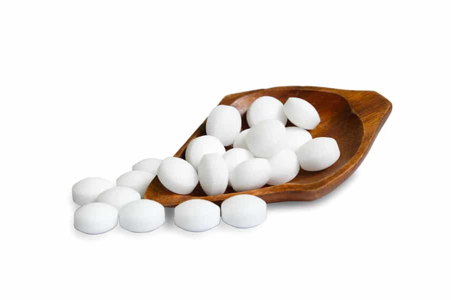 White Naphthalene Balls In A Wooden Bowl