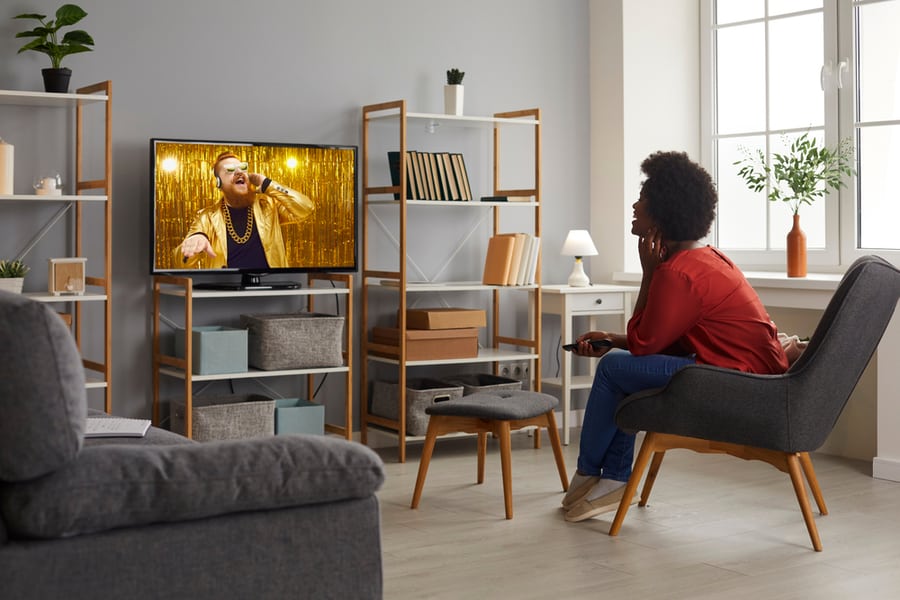 Woman Watching Tv On A Loud Volume