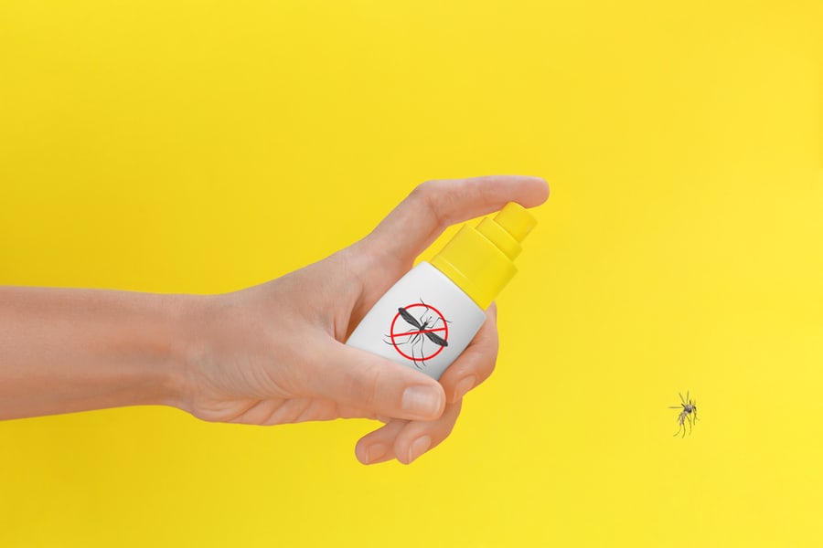 Women Spraying The Repellent On Insect