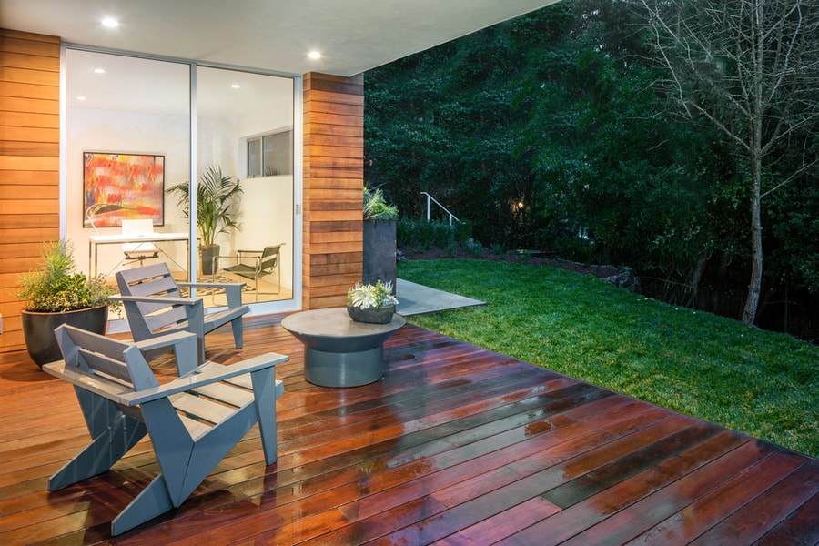 Wooden Deck / Balcony At Night With Furniture