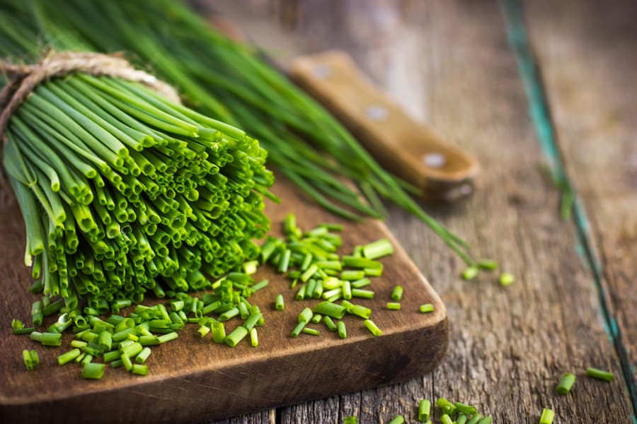 Bunch Fresh Chives On Wooden