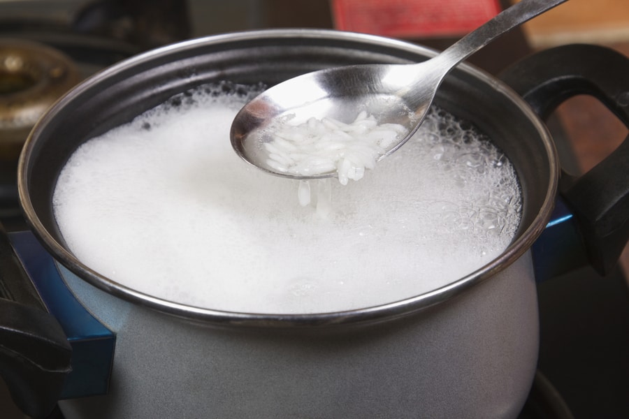 Closeup Spatula Over Pan Rice