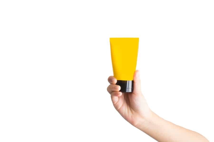 Cream Tube Mock Up On Kid Hands Isolated On White Background