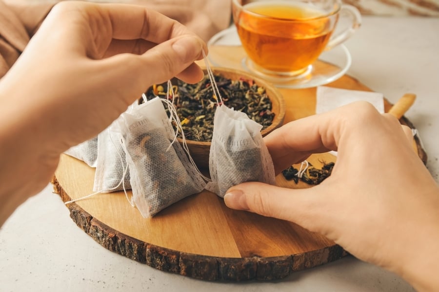 Woman Tea Bags Dry Leaves