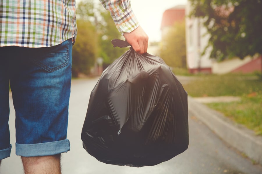 Young Man Out With Garbage