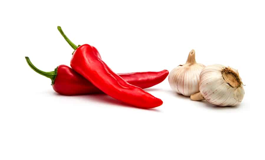 Cayenne And Garlic On A White Background