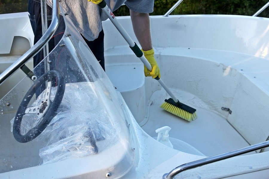 Cleaning Boat With Brush By Hands
