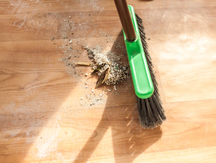 Closeup Photo Of Brush Cleaning Pile Of Debris