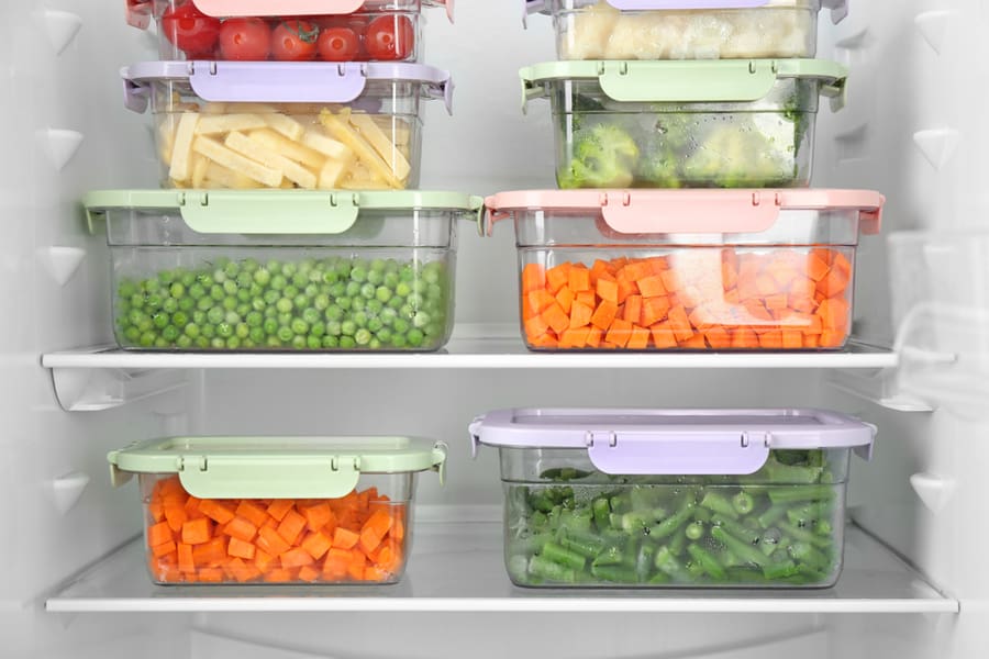 Food Items In Containers Inside The Refrigerator