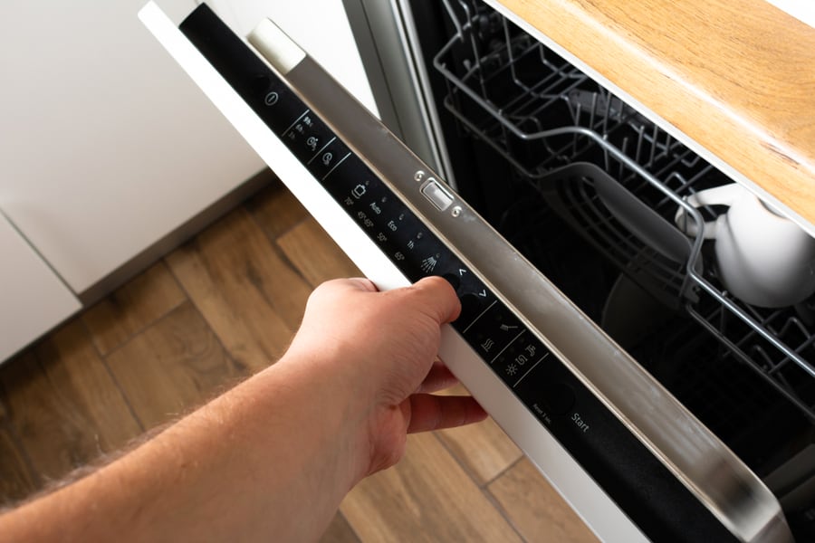 The Open Door Of Dishwasher With Control Panel