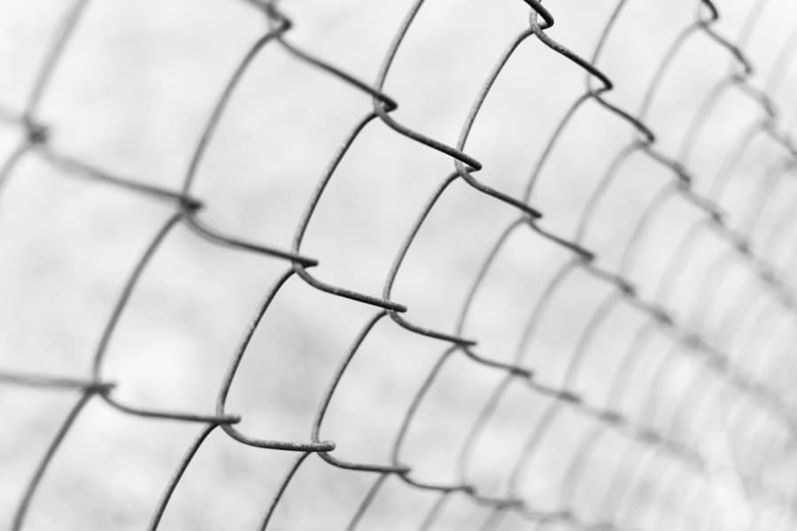 A Fence Made Of Metal Mesh