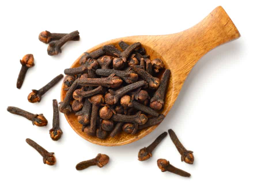 Dried Cloves In The Wooden Spoon