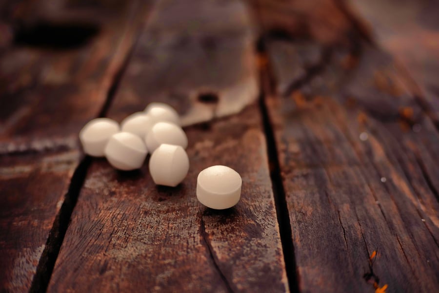 Moth Balls On Wooden Deck